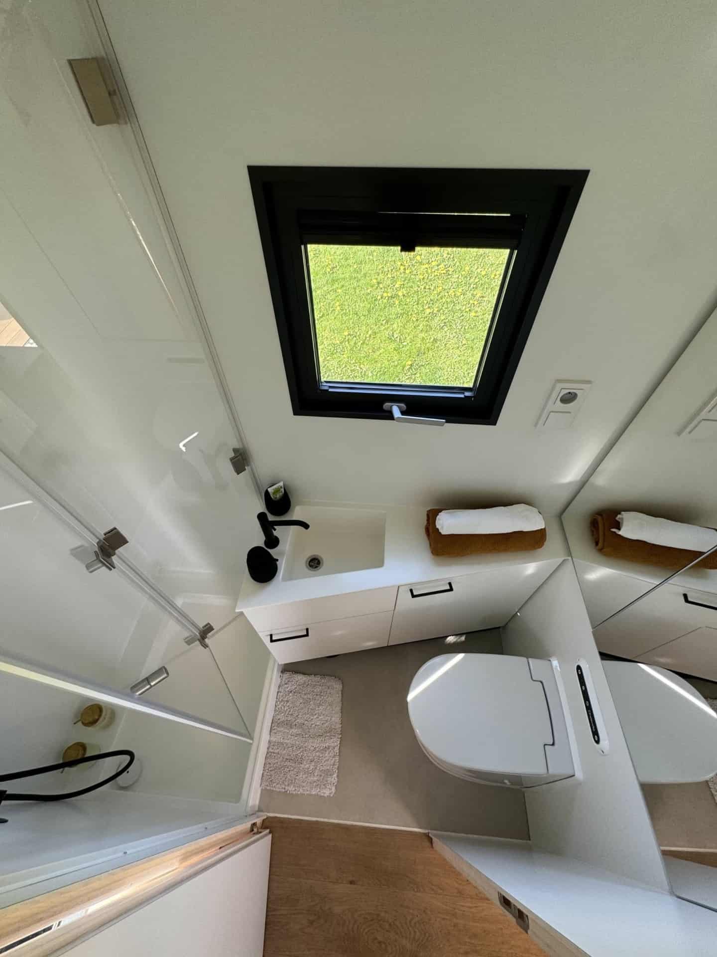 Bathroom in tiny house Hutka — shower and incinerating toilet